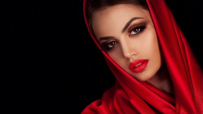 Elegant Woman in Red Hooded Fabric