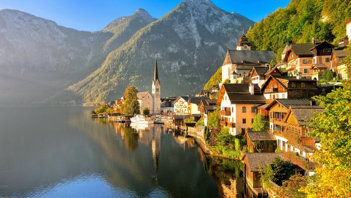 Autumn View of Lakeside Town with Mountains