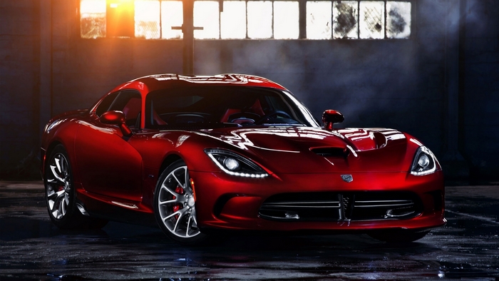 Red Dodge Viper parked in a garage