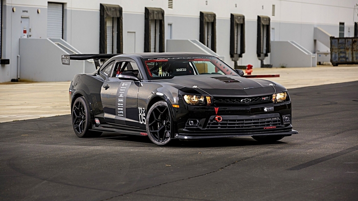 Black Chevrolet Camaro with racing modifications