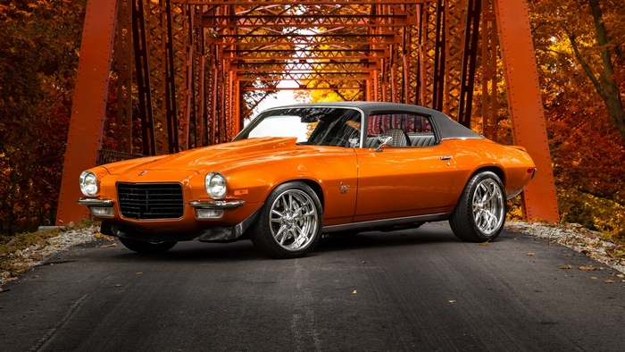 Orange 1970s Chevrolet Camaro on a bridge