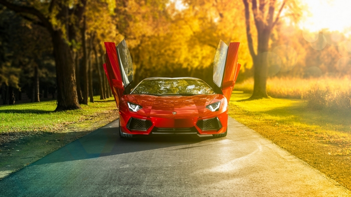 Red Lamborghini Aventador with doors open