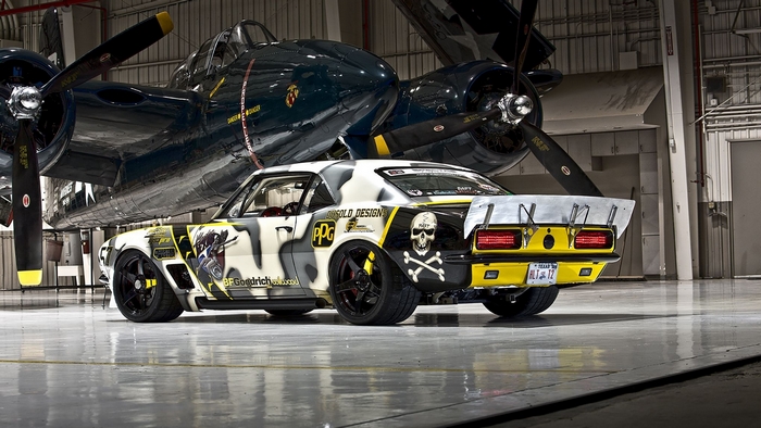 Custom Camaro in Hangar with Airplane