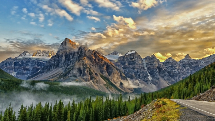 Mountain range with pine forest and road