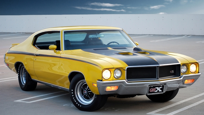 Yellow Buick GSX Muscle Car with Black Racing Stripes