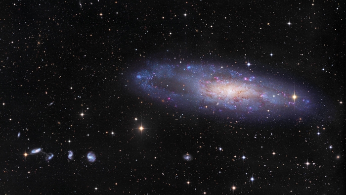 Vivid Spiral Galaxy Among Starry Cosmos