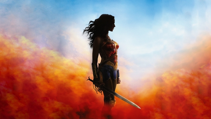 Wonder Woman Silhouette with Sword in Fiery Sky