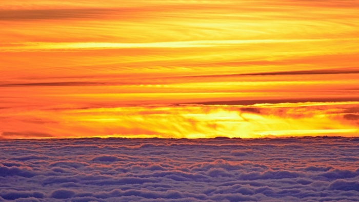 Sunset over clouds