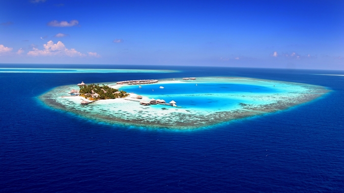 Island resort in the Maldives with overwater bungalows