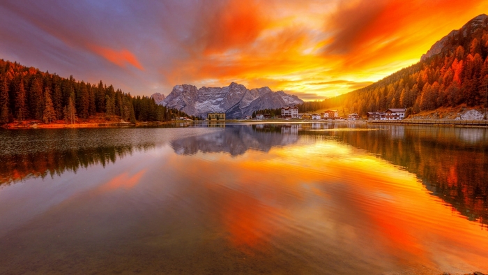 Fiery Autumn Sunset Over Tranquil Mountain Lake