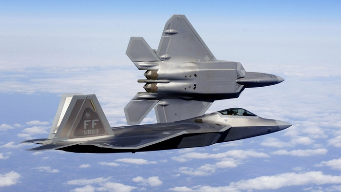 Two Lockheed Martin F-22 Raptor fighter jets in flight