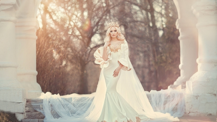 Woman in a white dress and crown