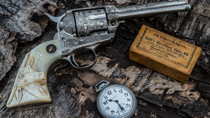 Colt's Revolver Cal. 45 with Ammunition and Pocket Watch