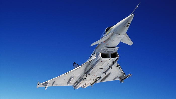 Eurofighter Typhoon fighter jet flying in clear blue sky