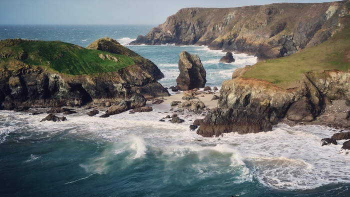 Rocky coastline with waves crashing on the shore