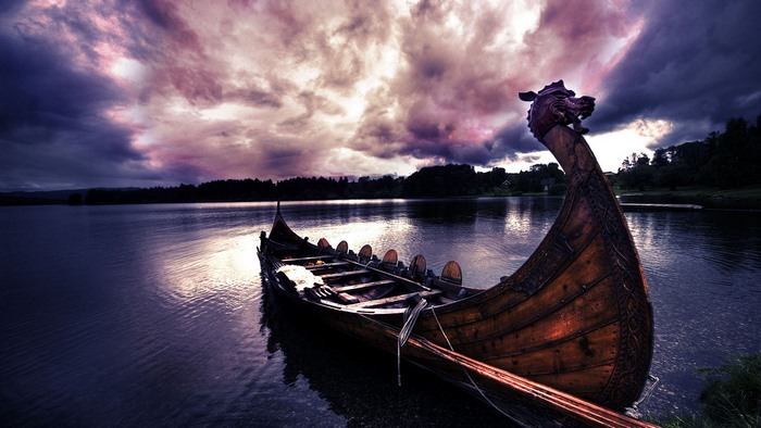 Viking boat on a lake at sunset