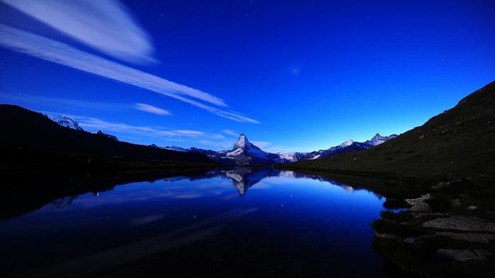 Matterhorn reflected in a lake at night