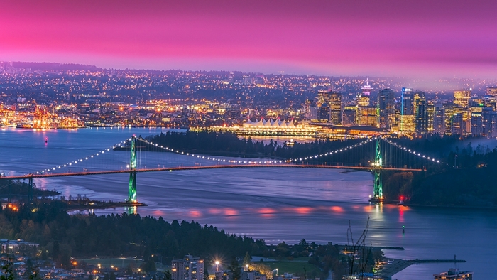 Vancouver cityscape with Lions Gate Bridge at sunset