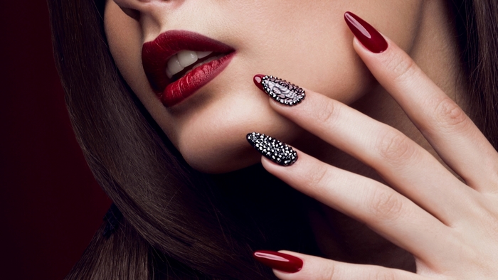 Elegant Woman with Red Lips and Detailed Nails