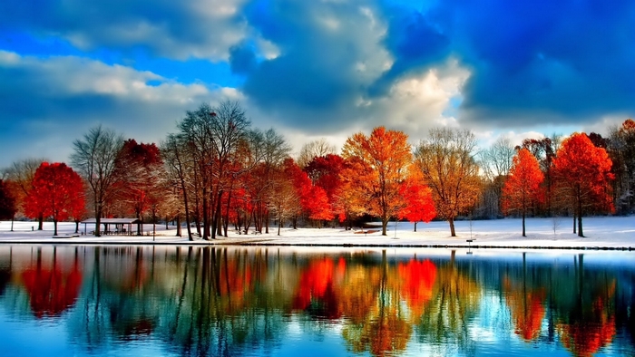 Autumn Trees Reflecting on Snowy Lake