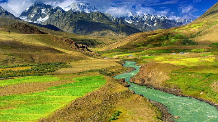 River flowing through a valley with mountains