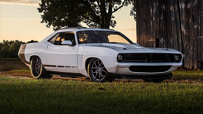 White classic Mopar muscle car parked outdoors