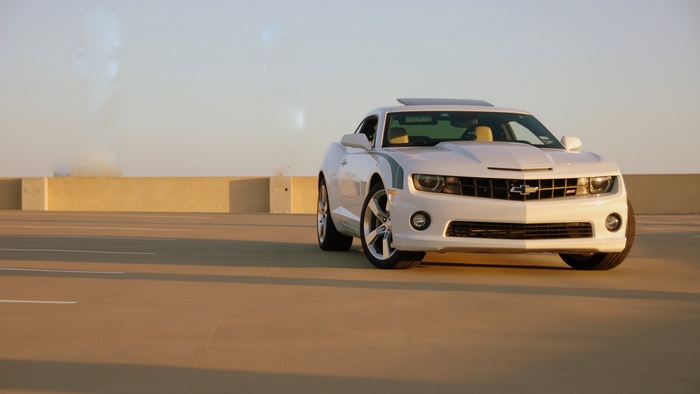 White Chevrolet Camaro SS with hockey stripes