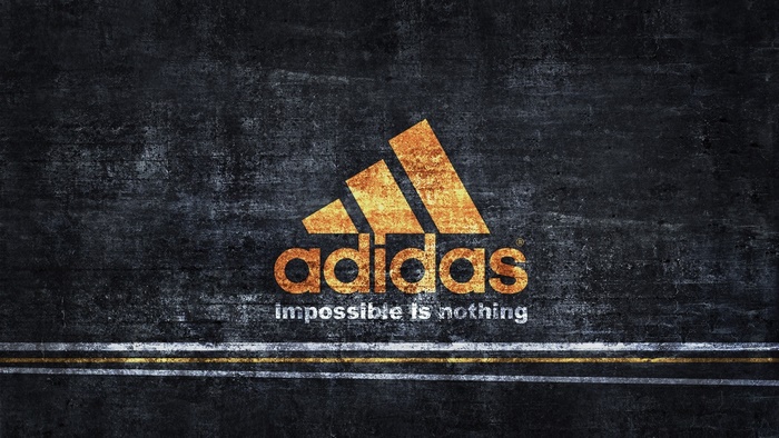 Adidas logo with slogan on textured background
