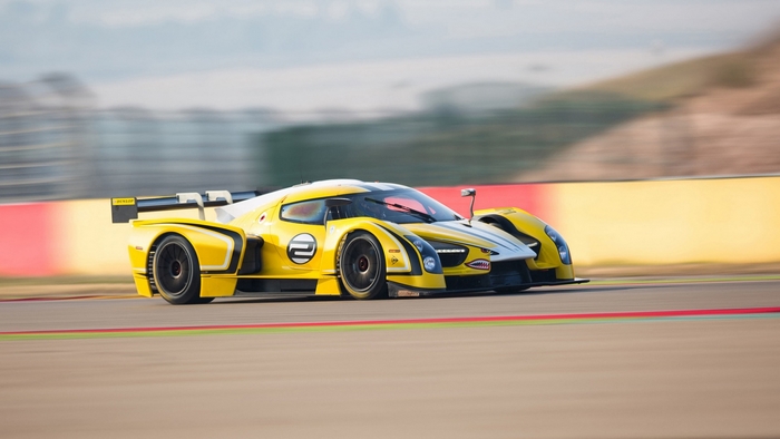 Yellow SCG Competizione Race Car on Track