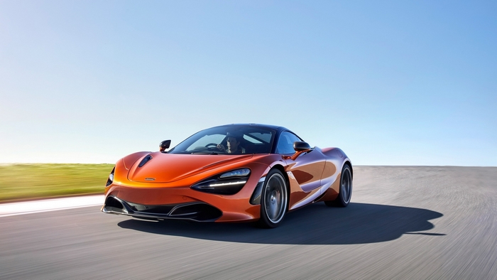 Orange McLaren 720S Coupe on a Racetrack
