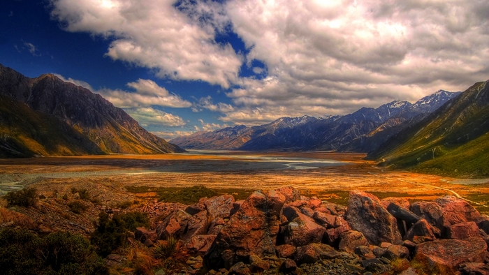 Mountain valley landscape in New Zealand with rocks