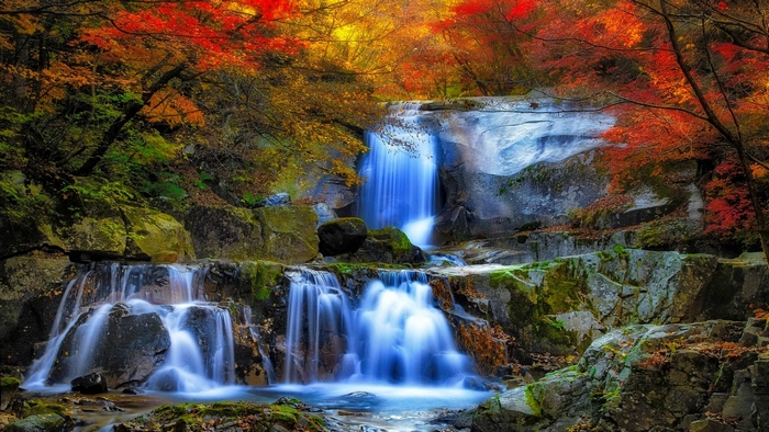 Autumn waterfall with colorful foliage