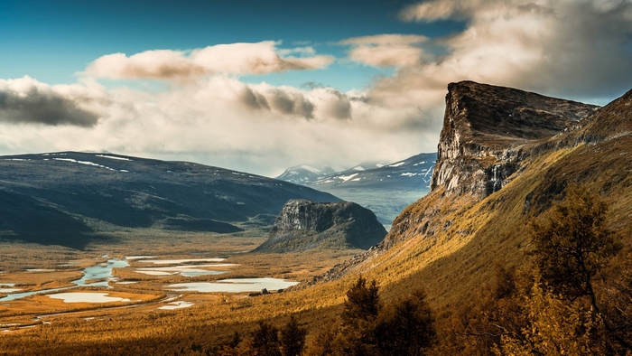 Mountain landscape with river and clouds