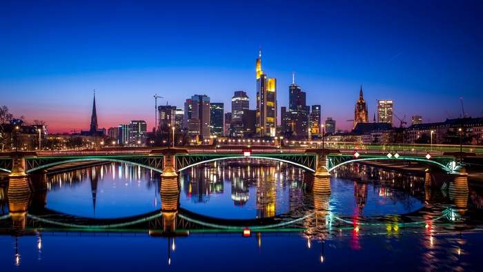 Frankfurt skyline at dusk with river reflection