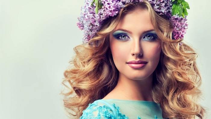 Blonde girl with flower crown and blue makeup