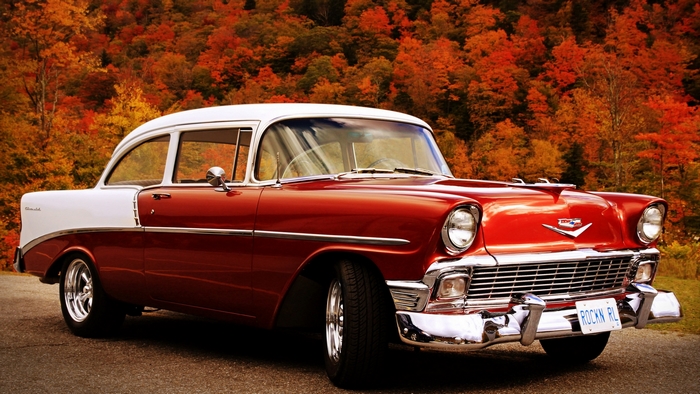 Red and white Chevrolet Bel Air car in autumn