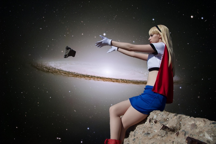 Supergirl in space with a galaxy