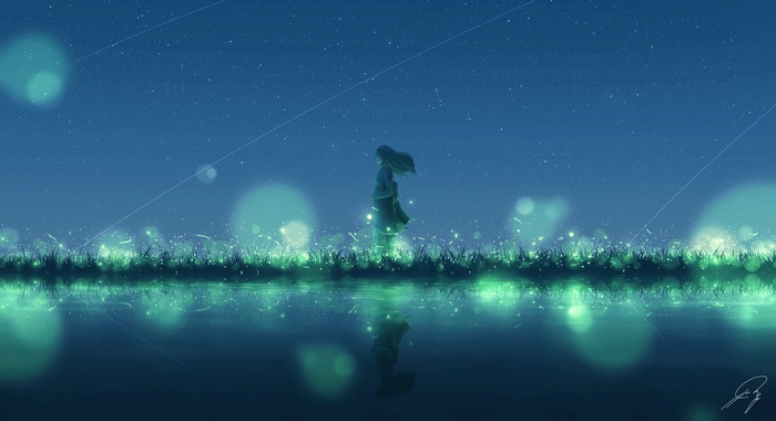 Girl standing in a field of glowing grass at night