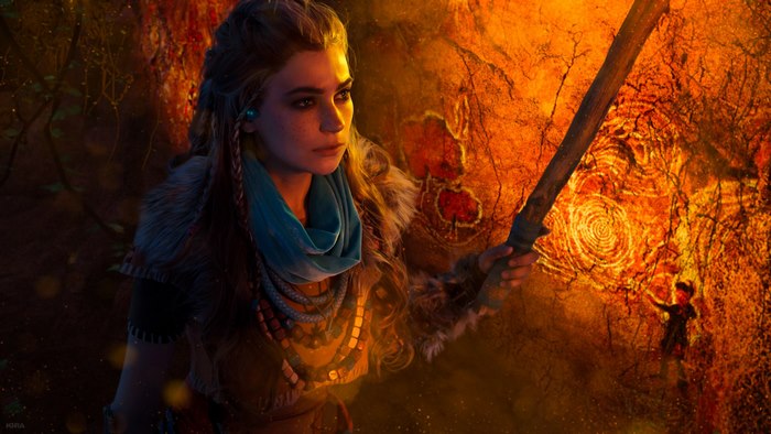 Aloy from Horizon Zero Dawn holding a torch