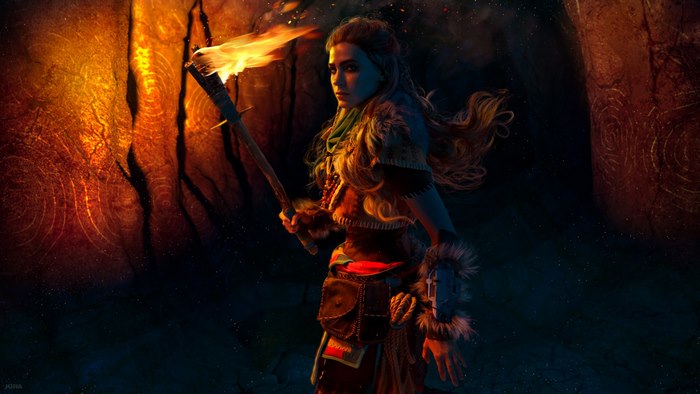 Aloy from Horizon Zero Dawn holding a torch