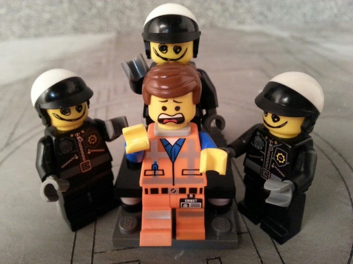 Emmet from The Lego Movie arrested by police officers