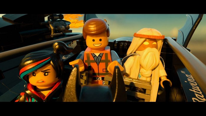 Emmet and two others in a vehicle