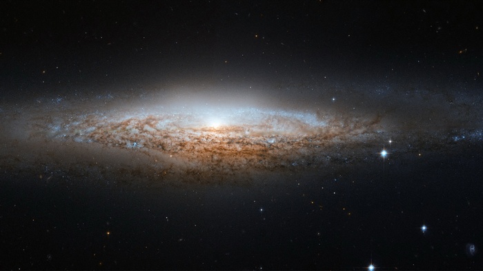 Spiral galaxy with bright core and dark dust lanes