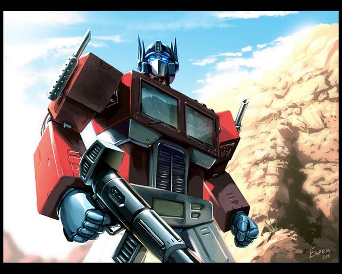 Optimus Prime with a rifle in a desert landscape