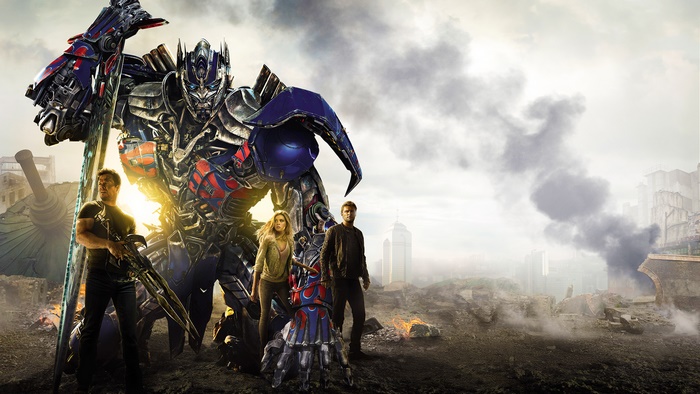 Optimus Prime and humans in a destroyed city