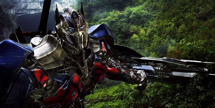 Optimus Prime with a rifle in a forest