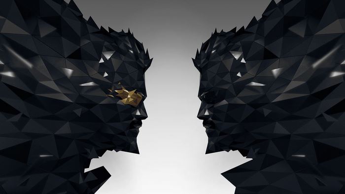 Two polygonal heads facing each other