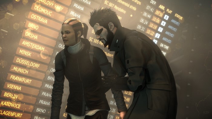 Adam Jensen and woman at airport departure board