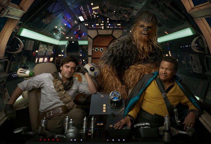 Chewbacca, Lando Calrissian, Poe Dameron, and BB-8 in the Millennium Falcon