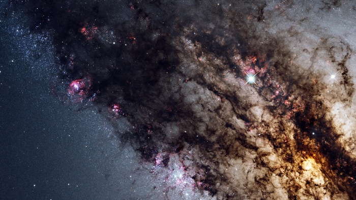 Dusty galaxy core with bright stars